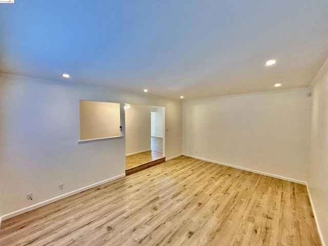 unfurnished room with light hardwood / wood-style flooring