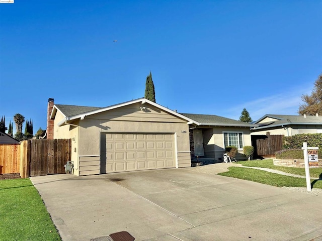 ranch-style home featuring a front yard and a garage