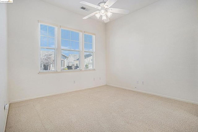 empty room with carpet and ceiling fan