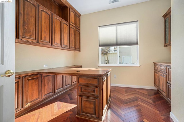 office area with dark parquet floors