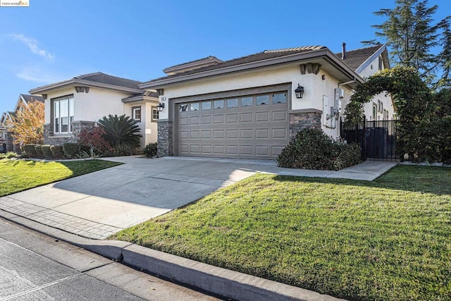 view of front facade with a front yard and a garage