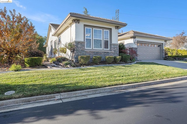 view of front of house with a front yard and a garage