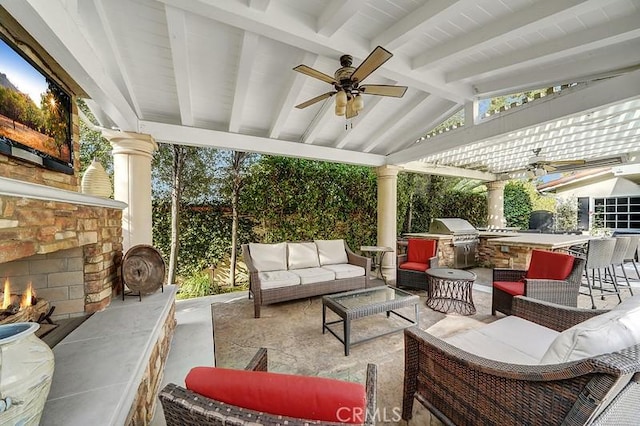 view of patio featuring outdoor lounge area, ceiling fan, grilling area, area for grilling, and a bar