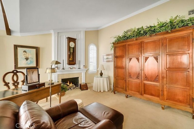 living area featuring light carpet, crown molding, and a tiled fireplace