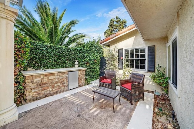 view of patio with exterior kitchen