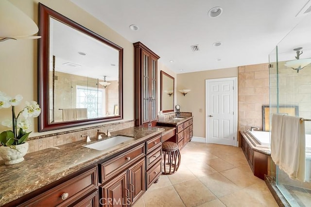 bathroom featuring vanity, tile patterned floors, and independent shower and bath