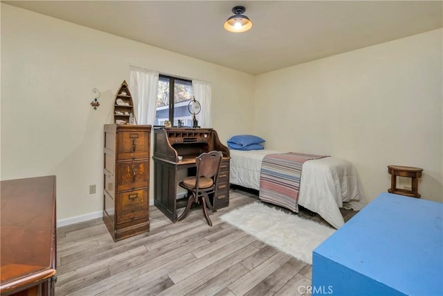 bedroom with light hardwood / wood-style flooring