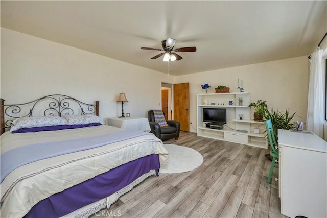 bedroom featuring hardwood / wood-style floors and ceiling fan