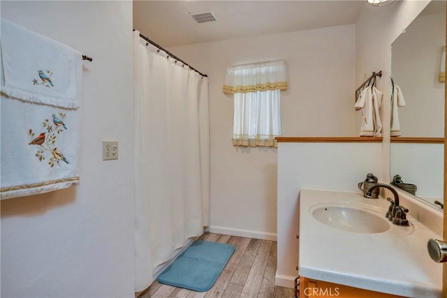 bathroom featuring hardwood / wood-style floors and vanity