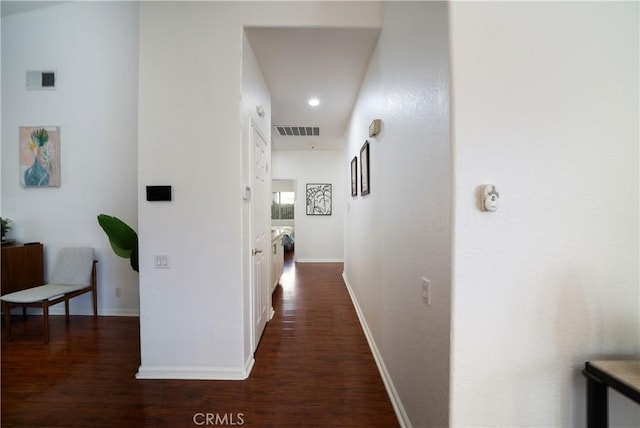 hallway with dark hardwood / wood-style flooring