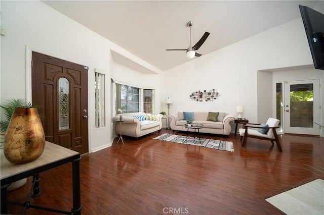 interior space with ceiling fan, dark hardwood / wood-style floors, and high vaulted ceiling