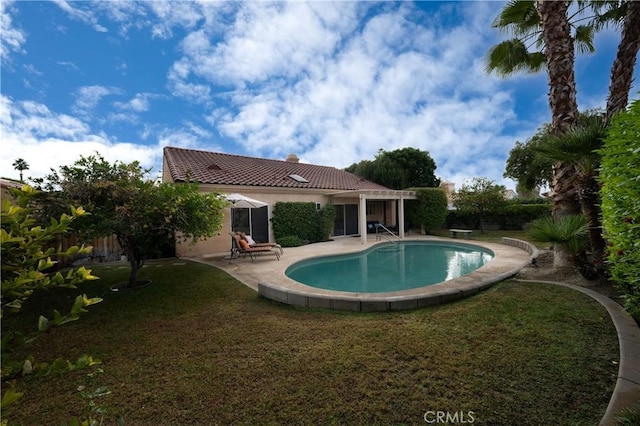 view of pool featuring a patio and a lawn