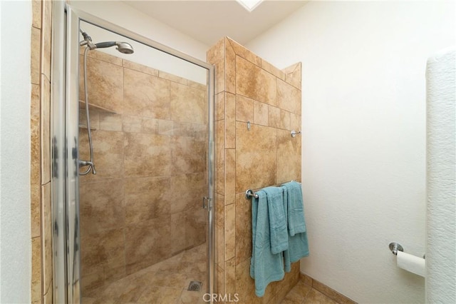 bathroom with a shower with shower door