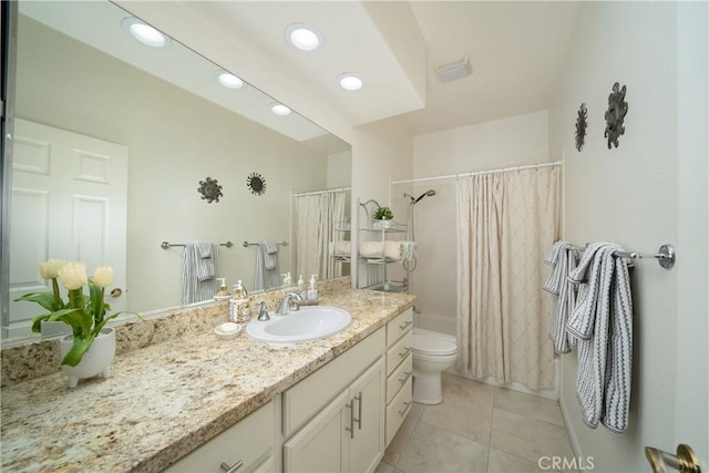 full bathroom featuring vanity, toilet, tile patterned flooring, and shower / bath combo with shower curtain