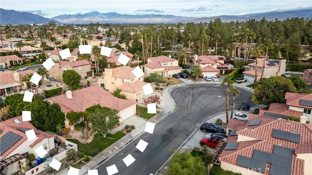 birds eye view of property featuring a mountain view