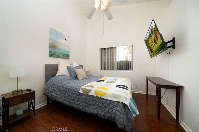 bedroom featuring ceiling fan and dark hardwood / wood-style flooring