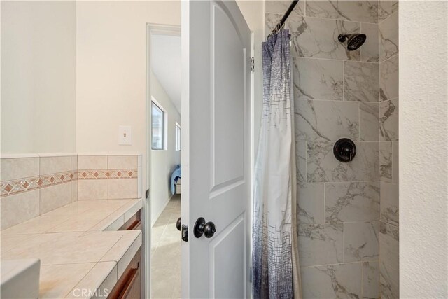 bathroom with curtained shower