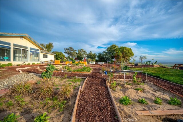 view of yard featuring a sunroom