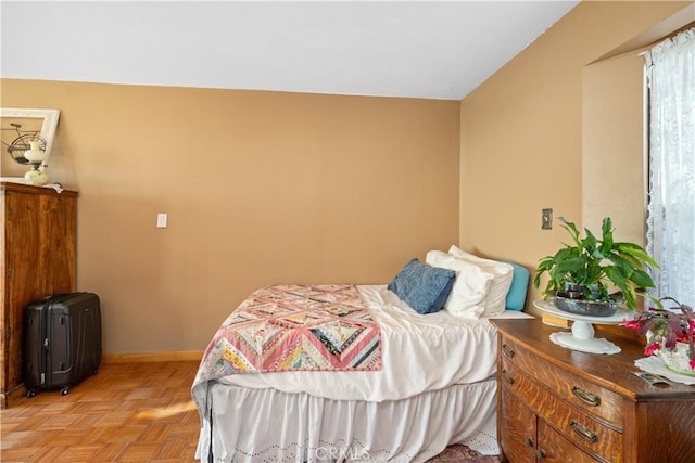 bedroom featuring light parquet floors