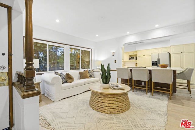 living room with light hardwood / wood-style flooring