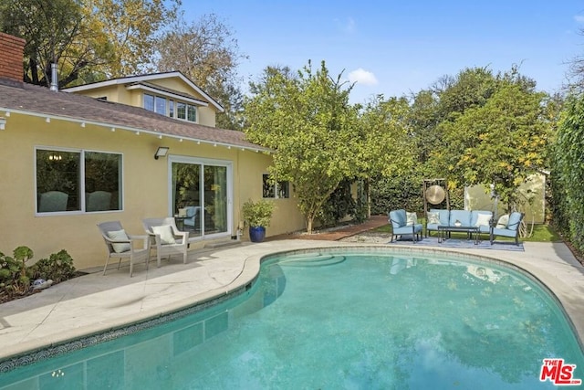 view of swimming pool with a patio area and outdoor lounge area