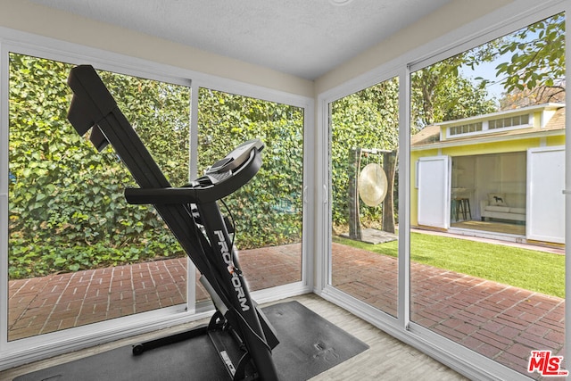 workout area with a textured ceiling