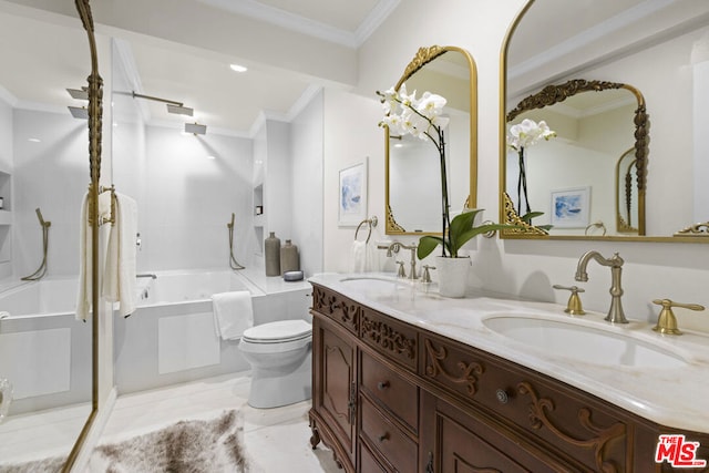 bathroom with a washtub, toilet, vanity, and ornamental molding