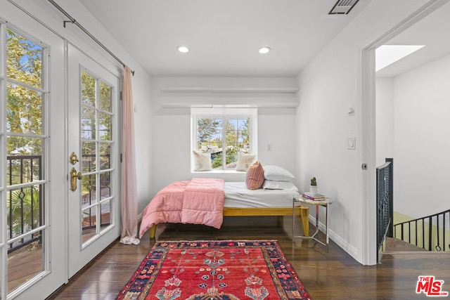 bedroom with dark wood-type flooring