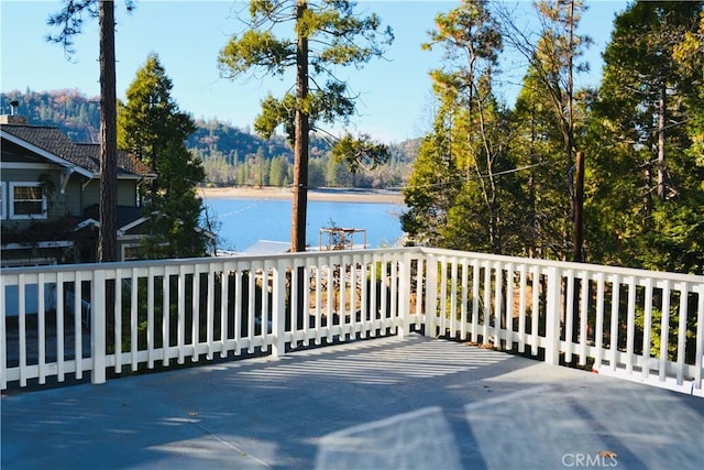 view of patio featuring a water and mountain view