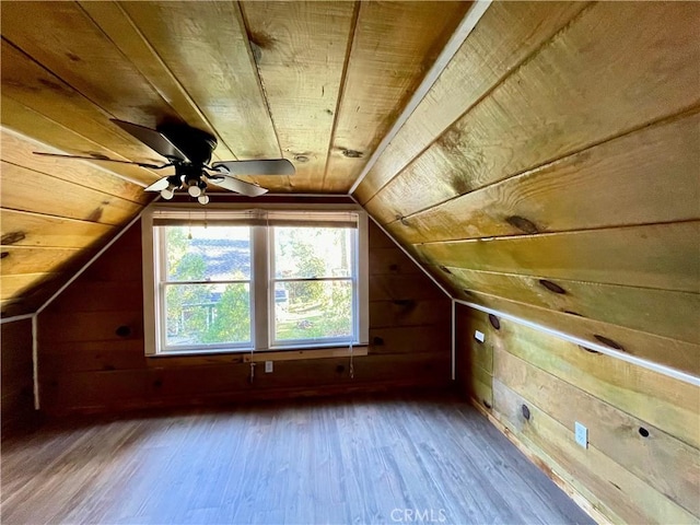 additional living space with lofted ceiling, wood ceiling, and hardwood / wood-style floors