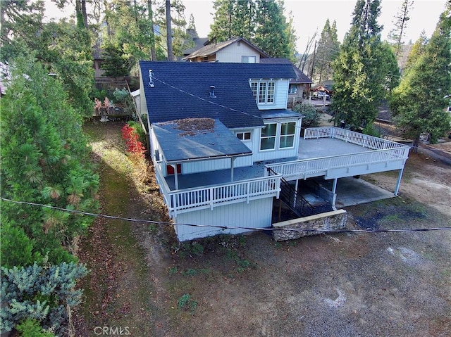 back of house featuring a deck