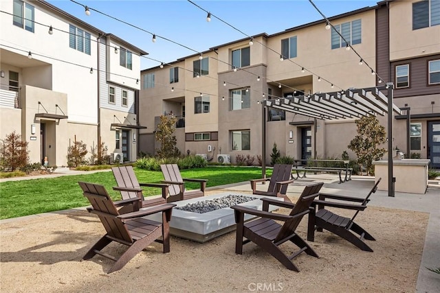 surrounding community featuring a yard and a fire pit