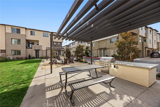 view of community featuring a lawn, exterior kitchen, a patio area, and a pergola