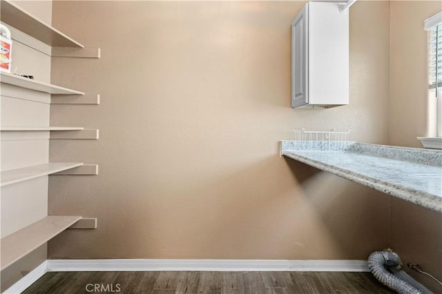 laundry area featuring dark hardwood / wood-style floors