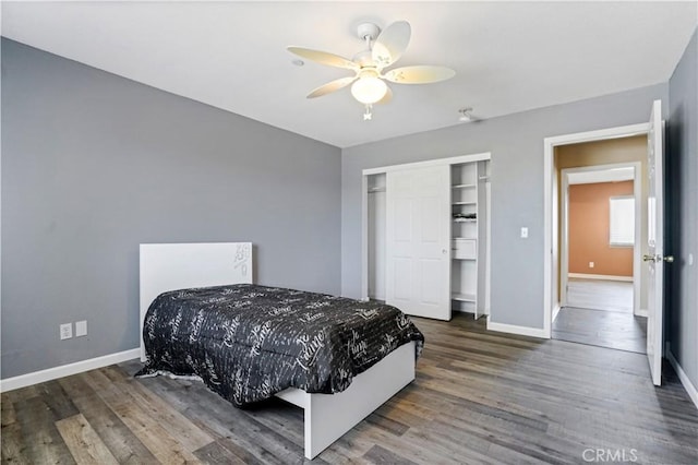 bedroom featuring a closet, ceiling fan, and dark wood-type flooring