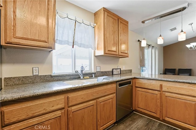 kitchen featuring dishwasher, sink, hanging light fixtures, dark hardwood / wood-style flooring, and a chandelier