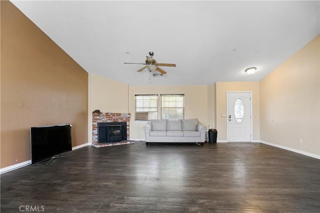 unfurnished living room with ceiling fan and dark wood-type flooring