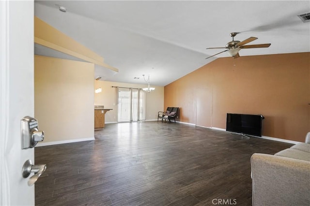 living room with ceiling fan with notable chandelier, dark wood-type flooring, and vaulted ceiling