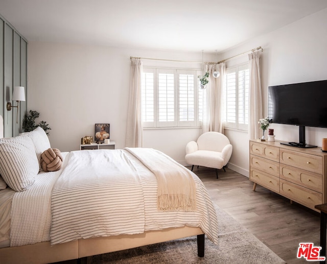 bedroom featuring wood-type flooring