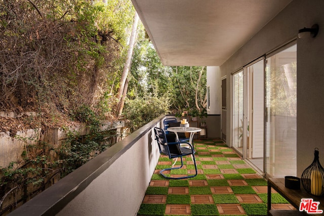 view of patio with a balcony