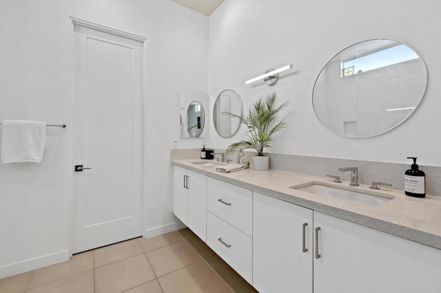 bathroom with tile patterned floors and vanity