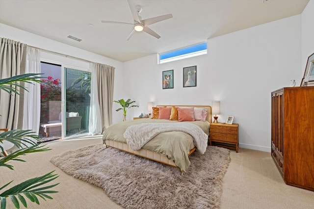 bedroom featuring light colored carpet and ceiling fan