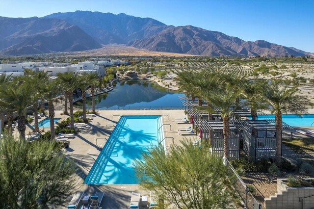 view of pool featuring a water and mountain view