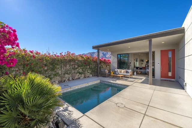 view of swimming pool featuring outdoor lounge area and a patio