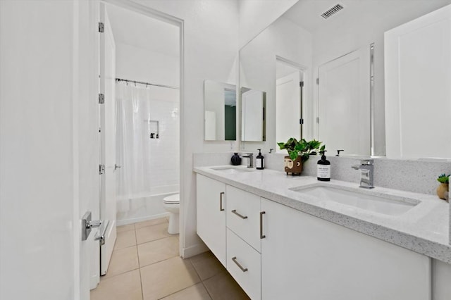 full bathroom featuring toilet, shower / tub combo, vanity, and tile patterned floors