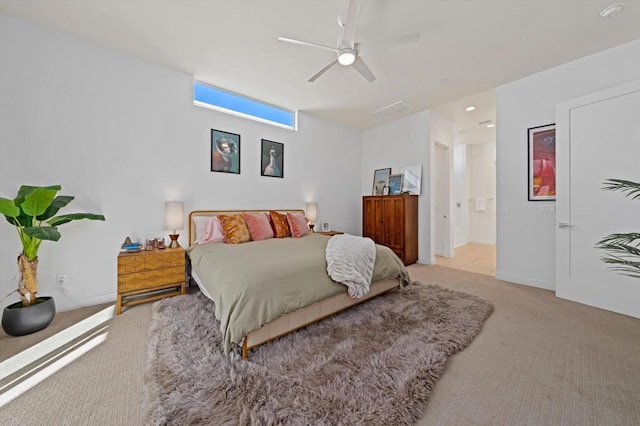 bedroom with ceiling fan and light carpet