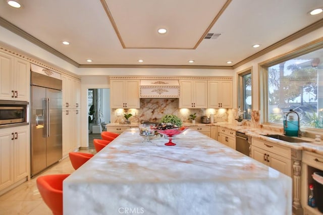 dining room featuring crown molding and sink