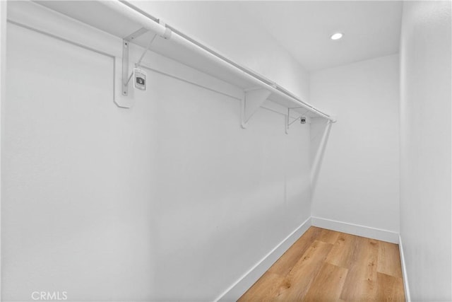 walk in closet featuring hardwood / wood-style floors