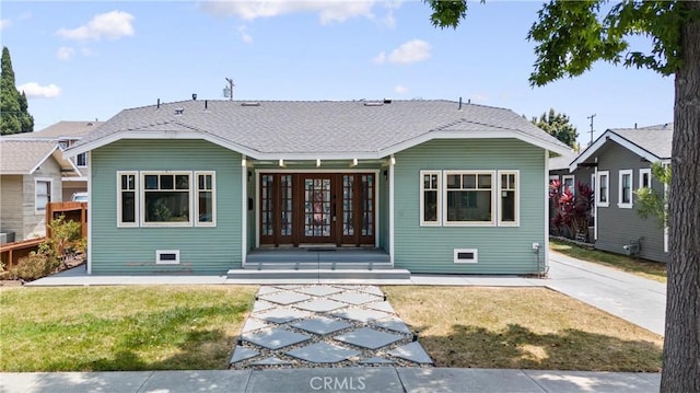 exterior space featuring french doors and a yard