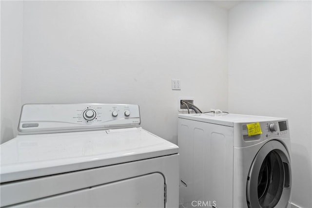 laundry room with washer and dryer